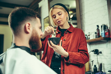 Image showing Client during beard shaving in barber shop