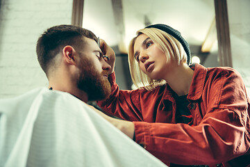 Image showing Client during beard shaving in barber shop