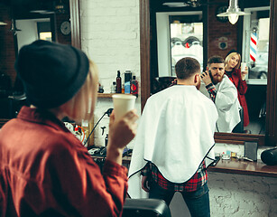 Image showing Client during beard shaving in barber shop