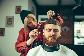 Image showing Client during beard shaving in barber shop