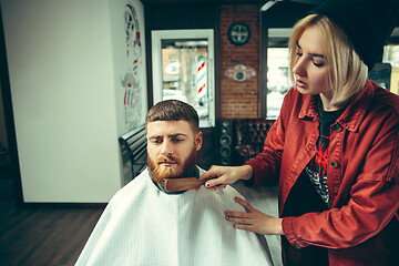 Image showing Client during beard shaving in barber shop