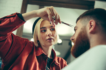 Image showing Client during beard shaving in barber shop