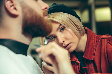 Image showing Client during beard shaving in barber shop