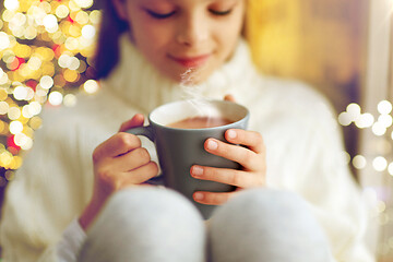 Image showing close up of girl with hot chocolate on christmas