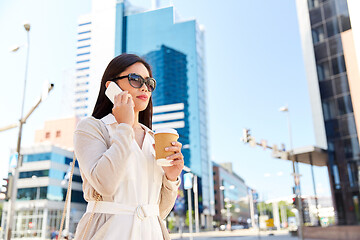 Image showing asian woman calling on smartphone in city