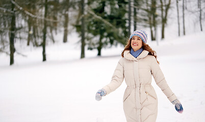 Image showing happy smiling woman outdoors in winter forest