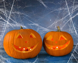 Image showing two pumpkins or jack o lanterns and spiderweb