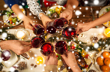 Image showing close up of friends with wine celebrate christmas