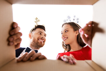 Image showing happy couple opening christmas gift box