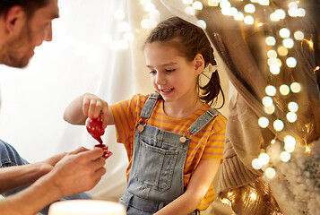 Image showing family playing tea party in kids tent at home