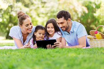 Image showing family with tablet pc on picnic in summer park