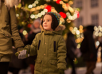 Image showing happy little boy with mother at christmas market