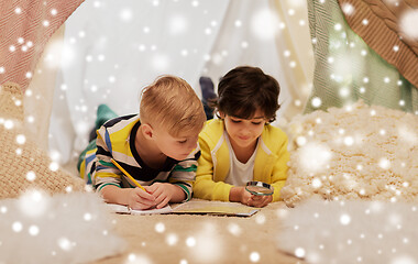 Image showing boys with magnifier and map in kids tent at home