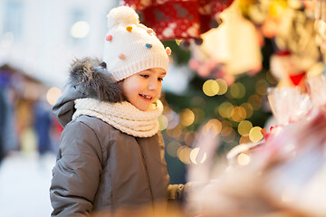 Image showing happy little girl at christmas market in winter