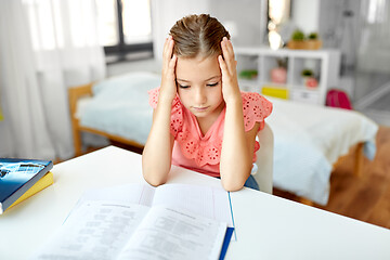 Image showing sad student girl with notebook at home