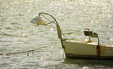 Image showing Small fishing boat on sunset