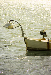Image showing Small fishing boat on sunset