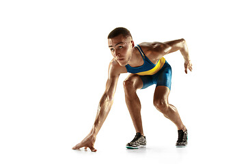 Image showing Young caucasian man running or jogging isolated on white studio background.