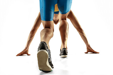 Image showing Young caucasian man running or jogging isolated on white studio background.