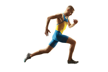 Image showing Young caucasian man running or jogging isolated on white studio background.