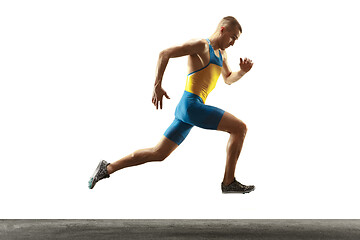 Image showing Young caucasian man running or jogging isolated on white studio background.