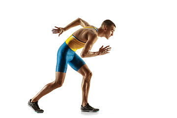 Image showing Young caucasian man running or jogging isolated on white studio background.