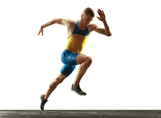 Image showing Young caucasian man running or jogging isolated on white studio background.