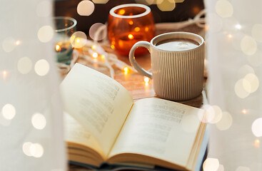 Image showing book and cup of coffee or hot chocolate on table