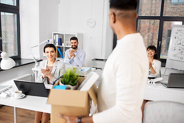 Image showing colleagues applauding to male office worker