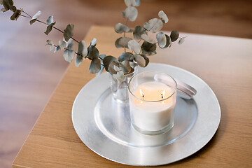 Image showing burning white candles on table at cozy home