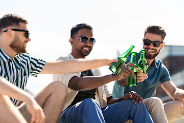 Image showing happy male friends drinking beer on street