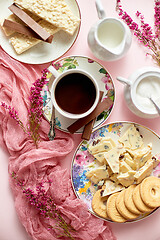 Image showing Hot chocolate or cocoa in cup with various sweets on sides. White chocolate bar and biscuits