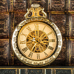 Image showing Antique clock dial close-up. Vintage pocket watch.