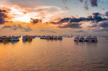 Image showing Boats on Mumbai water at dawn. Colaba region of Mumbai, Maharash