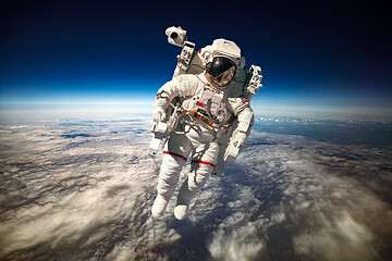 Image showing Astronaut in outer space against the backdrop of the planet eart