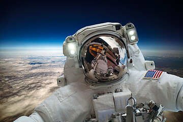 Image showing Astronaut in outer space against the backdrop of the planet eart