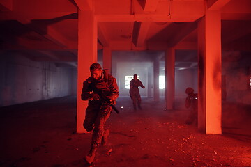 Image showing military troops in action urban environment