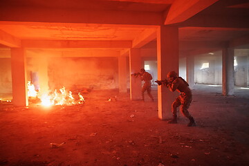 Image showing military troops in action urban environment