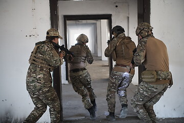 Image showing military troops in action urban environment