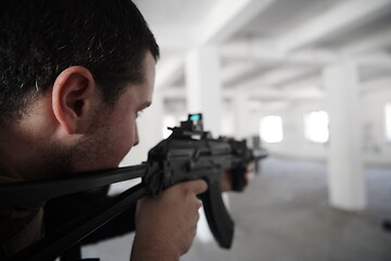Image showing special agent soldier aiming wearing casual clothing