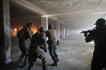 Image showing military troops in action urban environment