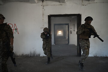 Image showing military troops in action urban environment