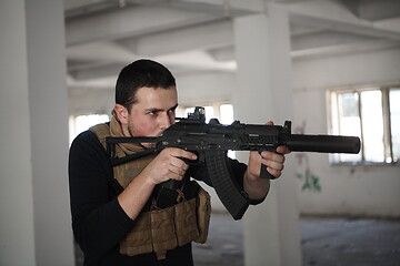 Image showing special agent soldier aiming wearing casual clothing