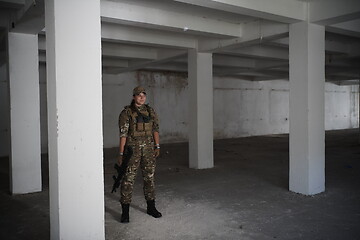 Image showing military female soldier having a break