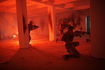 Image showing military troops in action urban environment