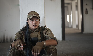 Image showing military female soldier having a break