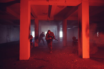 Image showing military troops in action urban environment