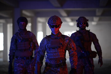 Image showing soldier squad team portrait in urban environment colored lightis