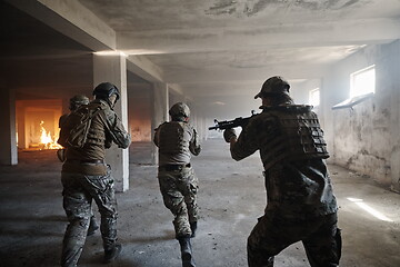 Image showing military troops in action urban environment