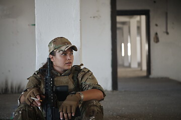 Image showing military female soldier having a break